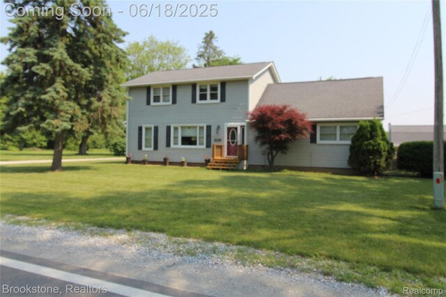 32599 Armada Ridge Rd, Richmond, MI 48062 - colonial home featuring a front yard