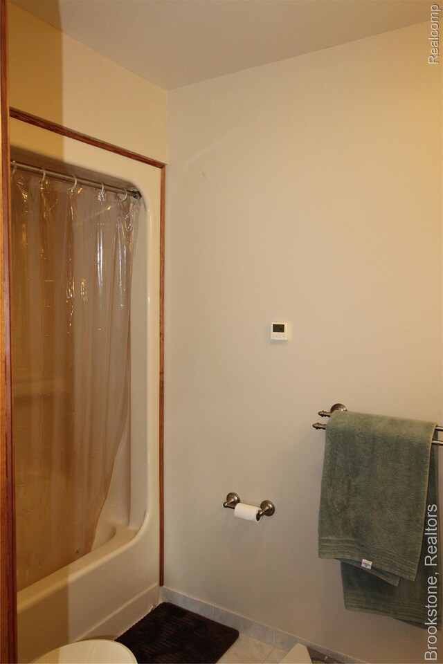 32599 Armada Ridge Rd, Richmond, MI 48062 - bathroom with shower / tub combo and tile patterned flooring