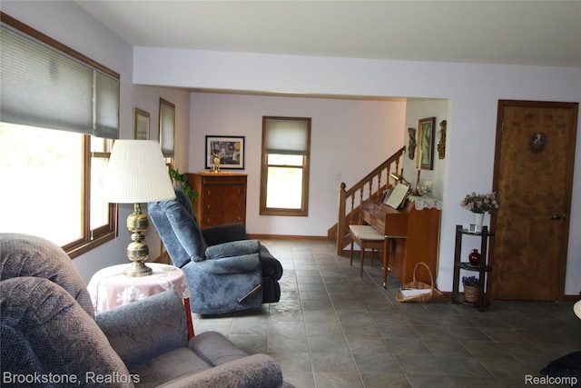 32599 Armada Ridge Rd, Richmond, MI 48062 - living area with plenty of natural light, stairway, and dark tile patterned floors