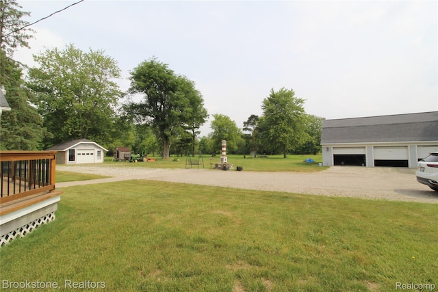 32599 Armada Ridge Rd, Richmond, MI 48062 - view of green lawn featuring an outdoor structure and a wooden deck