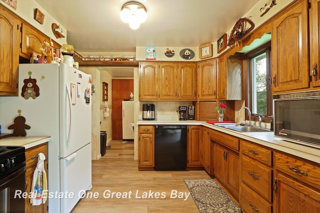 959 N Cass Ave, Vassar, MI 48768 - kitchen featuring black appliances, brown cabinets, light countertops, and light wood finished floors
