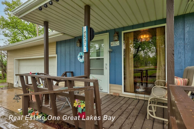 959 N Cass Ave, Vassar, MI 48768 - doorway to property featuring a garage and covered porch