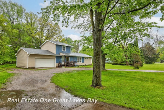 959 N Cass Ave, Vassar, MI 48768 - traditional-style house featuring a garage, a front yard, driveway, and view of scattered trees