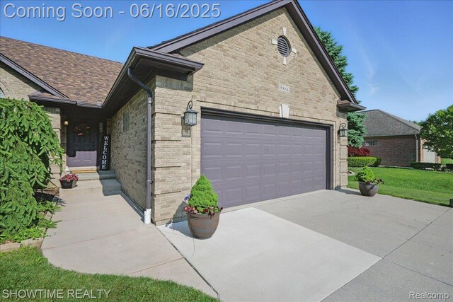 50064 Josephine Dr, Macomb, MI 48044 - view of side of property featuring stone siding and a lawn