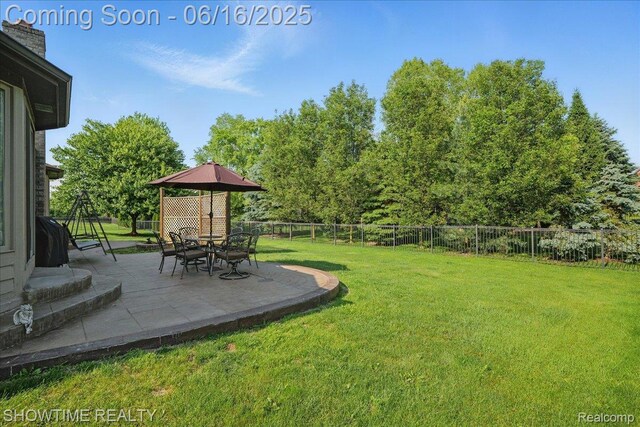 50064 Josephine Dr, Macomb, MI 48044 - fenced backyard featuring a patio area