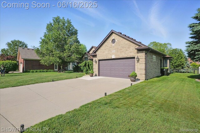 50064 Josephine Dr, Macomb, MI 48044 - view of front of property with concrete driveway, a garage, and brick siding