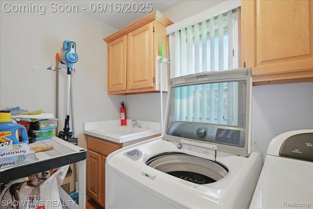 50064 Josephine Dr, Macomb, MI 48044 - laundry area featuring washer and dryer and cabinet space