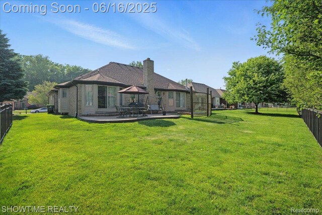 50064 Josephine Dr, Macomb, MI 48044 - back of house with a chimney and a patio area