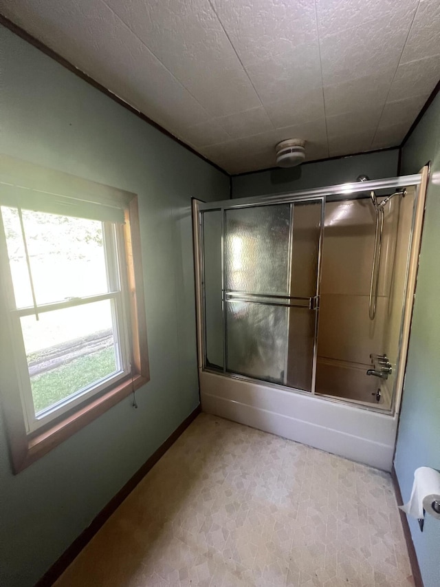 919 Nature Ln, Montgomery, MI 49255 - full bath featuring shower / bath combination with glass door and tile patterned floors