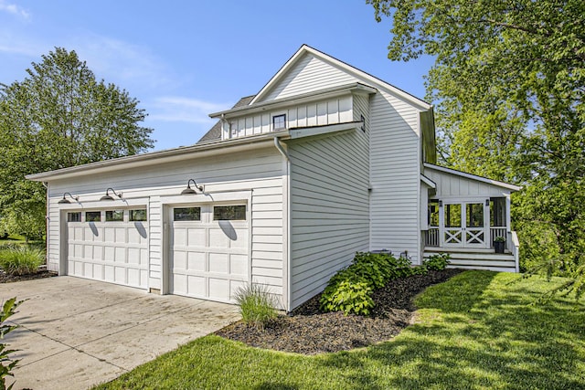 2377 Lake Birch Ct NE, Grand Rapids, MI 49525 - view of side of home featuring board and batten siding and a lawn
