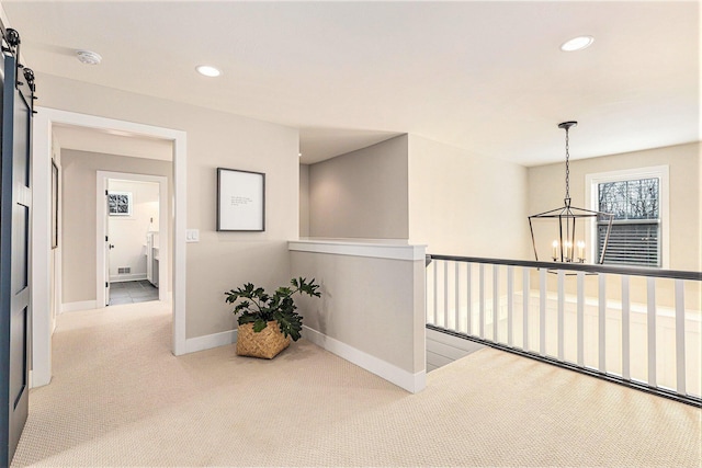2377 Lake Birch Ct NE, Grand Rapids, MI 49525 - corridor featuring a chandelier, carpet floors, recessed lighting, and an upstairs landing