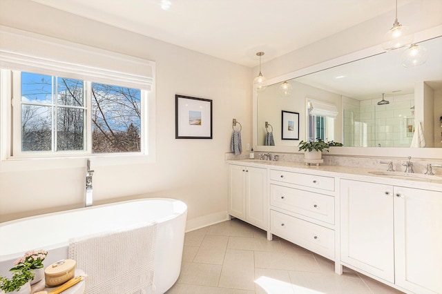 2377 Lake Birch Ct NE, Grand Rapids, MI 49525 - bathroom featuring a stall shower, a freestanding bath, double vanity, and tile patterned floors
