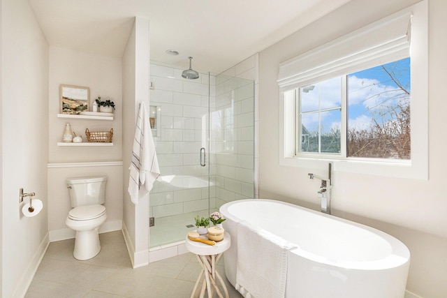 2377 Lake Birch Ct NE, Grand Rapids, MI 49525 - full bathroom featuring a stall shower, a freestanding bath, and tile patterned floors