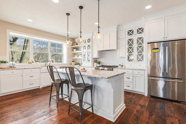 2377 Lake Birch Ct NE, Grand Rapids, MI 49525 - kitchen with freestanding refrigerator, white cabinets, and recessed lighting