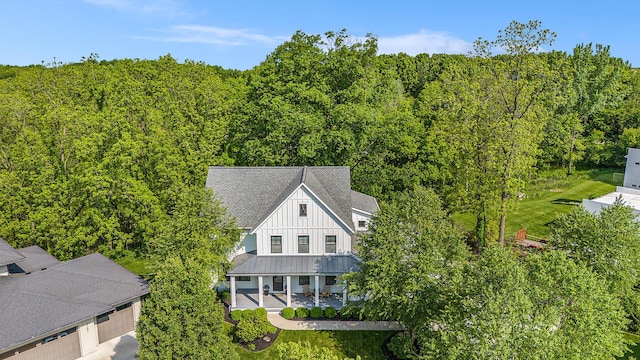 2377 Lake Birch Ct NE, Grand Rapids, MI 49525 - aerial view of property and surrounding area with a forest