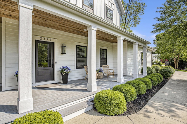 2377 Lake Birch Ct NE, Grand Rapids, MI 49525 - doorway to property featuring covered porch