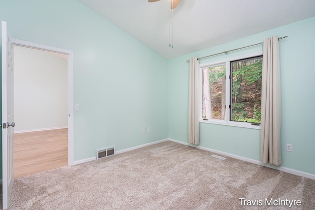 17909 Hidden Dunes Ln Unit B, Spring Lake, MI 49456 - empty room with carpet floors, vaulted ceiling, and a ceiling fan