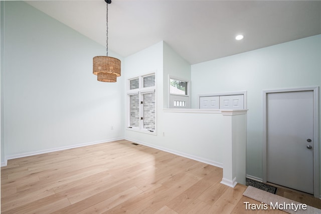 17909 Hidden Dunes Ln Unit B, Spring Lake, MI 49456 - unfurnished room featuring wood finished floors, a chandelier, high vaulted ceiling, and recessed lighting