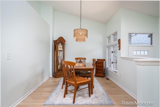 17909 Hidden Dunes Ln Unit B, Spring Lake, MI 49456 - dining room with light wood-type flooring and high vaulted ceiling