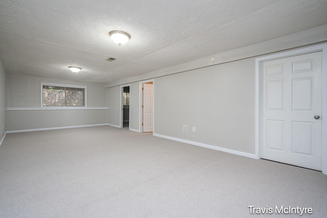 17909 Hidden Dunes Ln Unit B, Spring Lake, MI 49456 - below grade area featuring carpet flooring and a textured ceiling