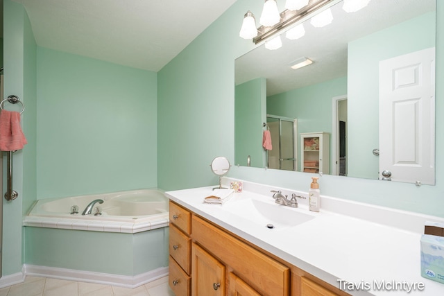 17909 Hidden Dunes Ln Unit B, Spring Lake, MI 49456 - bathroom featuring vanity, a garden tub, a stall shower, and tile patterned floors