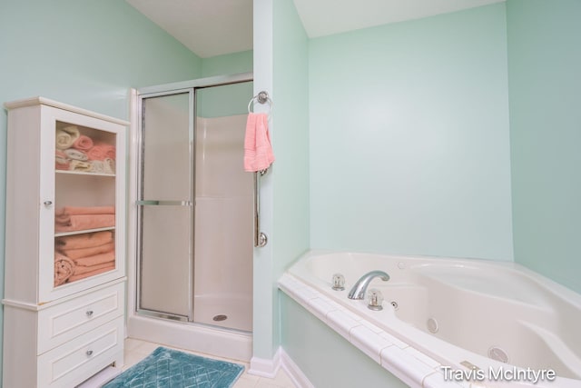 17909 Hidden Dunes Ln Unit B, Spring Lake, MI 49456 - bathroom with a shower stall, a jetted tub, and tile patterned flooring