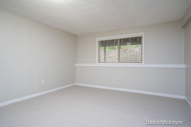 17909 Hidden Dunes Ln Unit B, Spring Lake, MI 49456 - carpeted spare room with a textured ceiling and baseboards