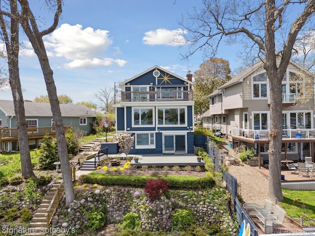 3806 Island Park Dr, Waterford, MI 48329 - back of house with a balcony and a patio