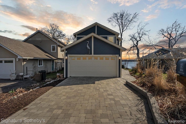 3806 Island Park Dr, Waterford, MI 48329 - view of front of house featuring a garage and driveway