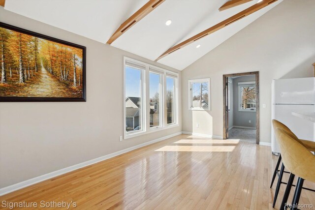 3806 Island Park Dr, Waterford, MI 48329 - unfurnished dining area featuring beamed ceiling, light wood-style flooring, recessed lighting, and high vaulted ceiling