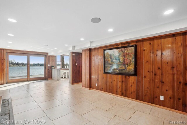 3806 Island Park Dr, Waterford, MI 48329 - empty room with wood walls and recessed lighting