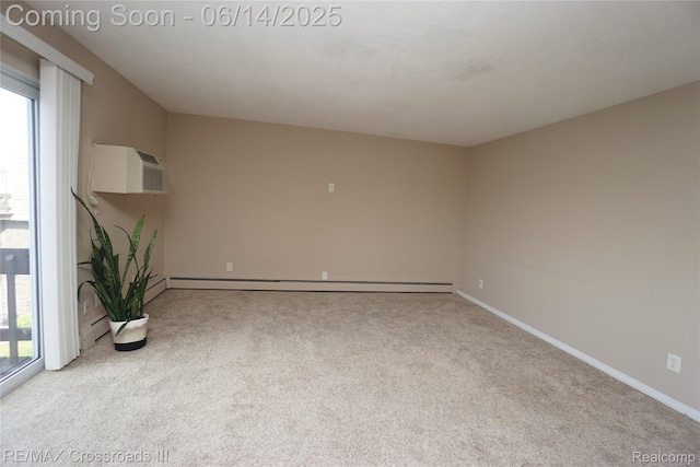 250 N Liberty St Unit 310, Belleville, MI 48111 - carpeted empty room featuring a wall unit AC and a baseboard radiator
