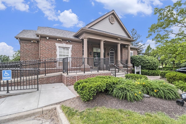 2756 Barclay Way, Ann Arbor, MI 48105 - view of front of property with brick siding, a porch, and roof with shingles