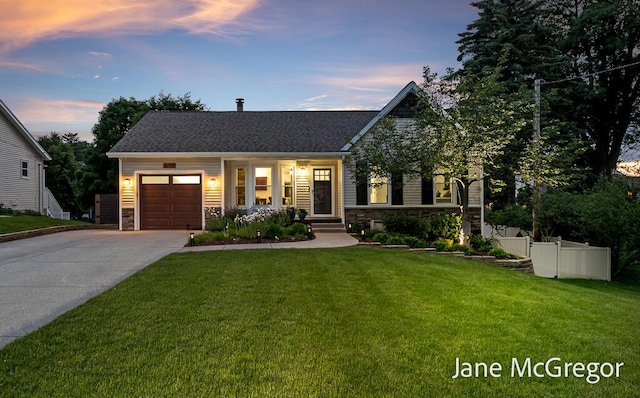 15159 Westray St, Grand Haven, MI 49417 - view of front of property featuring stone siding, an attached garage, and driveway