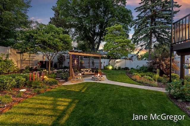 15159 Westray St, Grand Haven, MI 49417 - fenced backyard featuring an outdoor fire pit and a patio