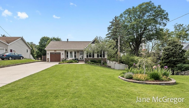 15159 Westray St, Grand Haven, MI 49417 - view of front facade with concrete driveway, an attached garage, and a front lawn