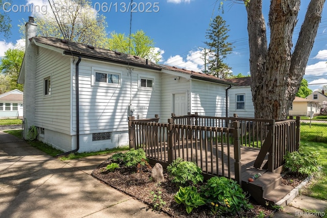1904 Academy St, Ferndale, MI 48220 - rear view of house with a deck and a chimney
