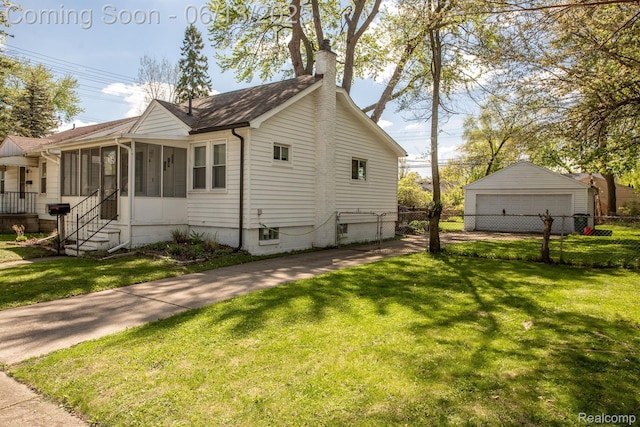 1904 Academy St, Ferndale, MI 48220 - view of side of home featuring a chimney, a sunroom, and a garage