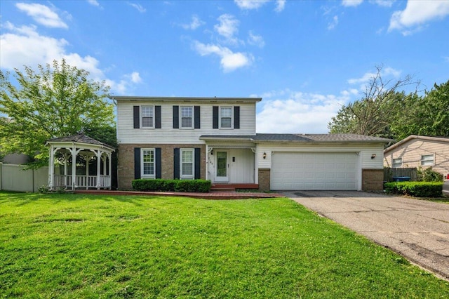 2144 Stanford Dr SE, Kentwood, MI 49508 - traditional home with a gazebo, brick siding, a garage, and driveway