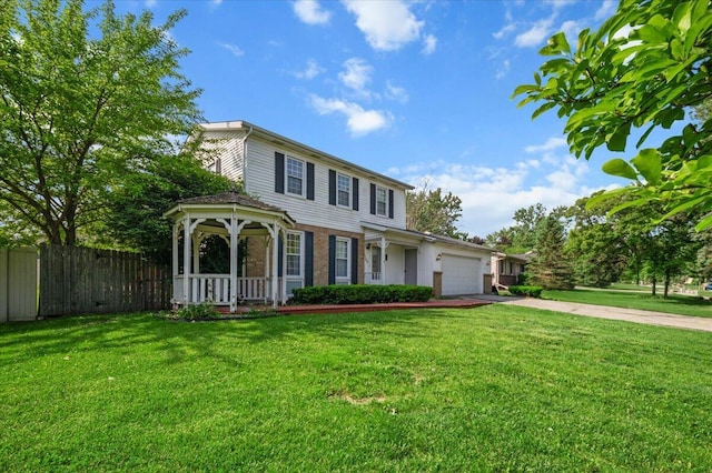 2144 Stanford Dr SE, Kentwood, MI 49508 - view of front of property featuring driveway, a garage, and covered porch