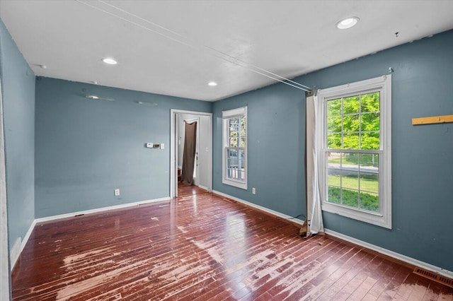 2144 Stanford Dr SE, Kentwood, MI 49508 - spare room featuring wood-type flooring and recessed lighting
