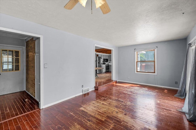 2144 Stanford Dr SE, Kentwood, MI 49508 - unfurnished room with hardwood / wood-style floors, ceiling fan, and a textured ceiling