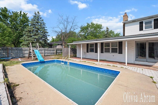 2144 Stanford Dr SE, Kentwood, MI 49508 - view of swimming pool with a wooden deck