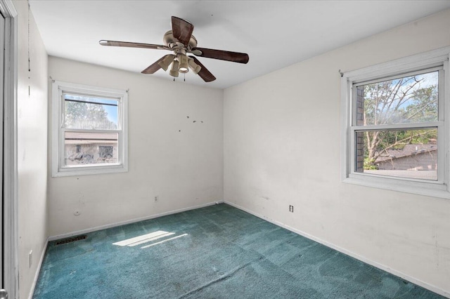 2144 Stanford Dr SE, Kentwood, MI 49508 - carpeted empty room with a ceiling fan and baseboards