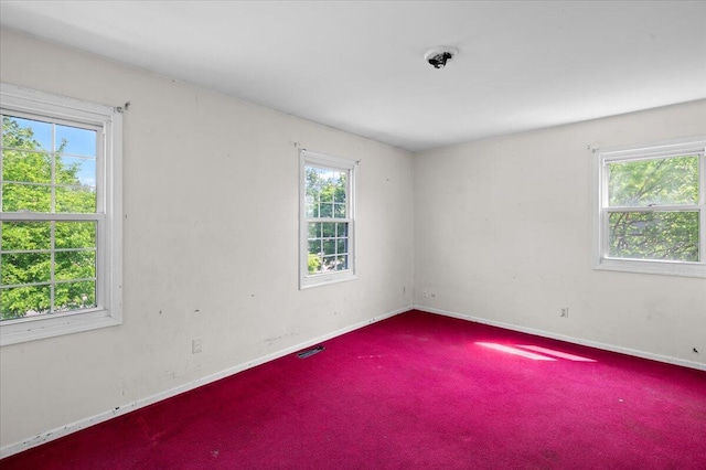 2144 Stanford Dr SE, Kentwood, MI 49508 - carpeted empty room with baseboards