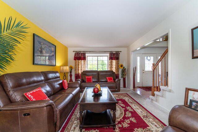 5992 Cedar Ridge Dr, Ann Arbor, MI 48103 - living area featuring stairs and carpet floors