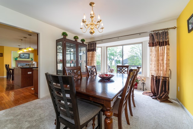 5992 Cedar Ridge Dr, Ann Arbor, MI 48103 - dining space featuring light carpet and a chandelier
