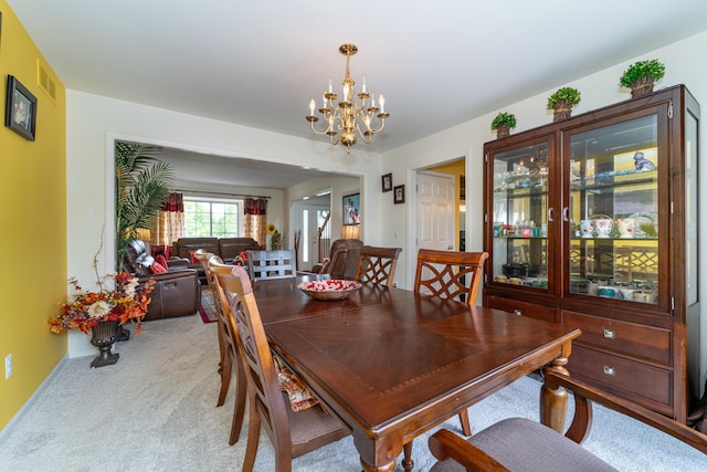 5992 Cedar Ridge Dr, Ann Arbor, MI 48103 - dining space featuring light carpet and a chandelier