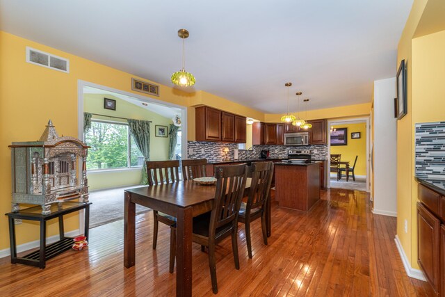 5992 Cedar Ridge Dr, Ann Arbor, MI 48103 - dining room with hardwood / wood-style floors and baseboards