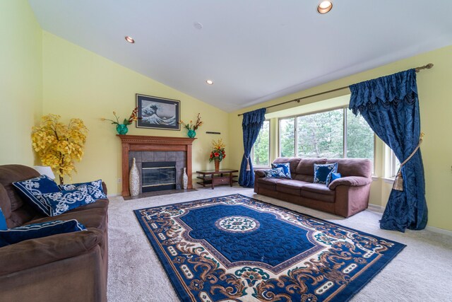 5992 Cedar Ridge Dr, Ann Arbor, MI 48103 - living room featuring carpet flooring, lofted ceiling, recessed lighting, and a tiled fireplace